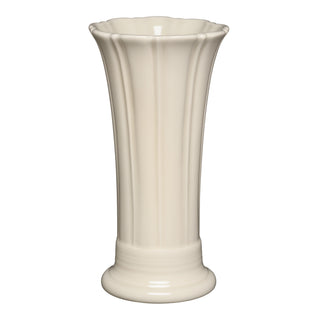 The Fiesta 9 5/8 Inch Medium Vase by Fiesta features a linen color, fluted design, round base, and a slightly flared, scalloped rim.