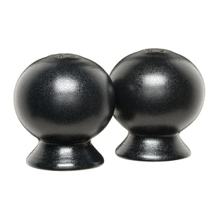 The Fiesta Foundry 2 5/8 Inch Salt and Pepper Shaker Set features two round, black, matte-finish shakers with wide bases, displayed side by side on a white background. Their sleek silhouette subtly reflects Art Deco styling, making them a striking addition to any Fiesta Dinnerware collection.