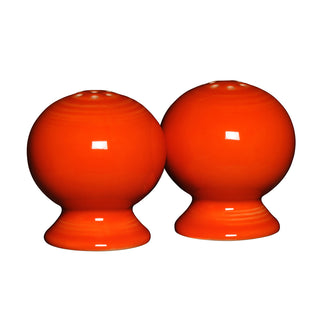 The New Retired Fiesta 2 5/8 Inch Salt and Pepper Shaker Set in glossy Poppy adds classic Art Deco flair to your table, pairing perfectly with your Fiesta Dinnerware collection. Both shakers are round with small holes on top.
