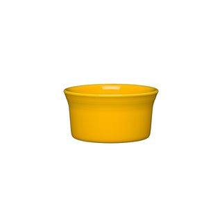 The Fiesta New Retired 8 OZ Ramekin is a small, round, daffodil-yellow ceramic dish with a smooth finish, made in the USA and shown against a plain white background.