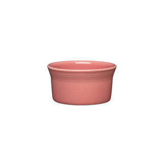 The Fiesta New Retired 8 OZ Ramekin in Peony is oven safe and perfect for serving desserts or snacks. Measures 4 inches and features a pink color with a white background.