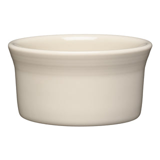 The Fiesta 8 OZ Ramekin 4 Inch by Fiesta features a linen color and smooth, off-white ceramic design with a slightly flared rim. This oven-safe ramekin is shown against a white background.