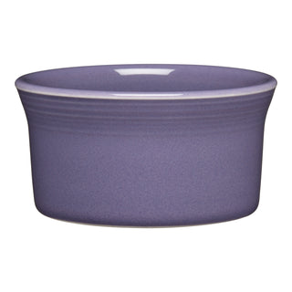 The Fiesta Lavender 8 OZ Ramekin, 4 inches round with slightly flared sides and a smooth finish, is ceramic, oven safe, made in the USA, and shown on a white background.