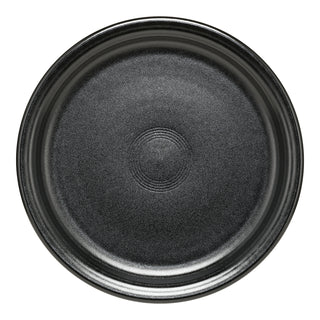 A round, empty black Foundry Bistro Coupe 9 Inch Luncheon Plate by Fiesta with a textured matte finish and slightly raised rim, made in the USA, shown from above on a white background.
