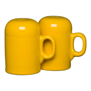 The New Retired Fiesta 4 5/8 Inch Rangetop Large Salt and Pepper Shaker Set by Fiesta in Daffodil is shown with two handled shakers side by side against a white background.