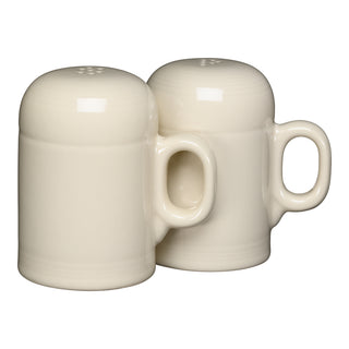 Two linen-colored Fiesta 4 5/8 Inch Rangetop Large Salt and Pepper Shakers with handles, resembling mugs, sit side by side on a white background. This dishwasher-safe set is proudly made in the USA.