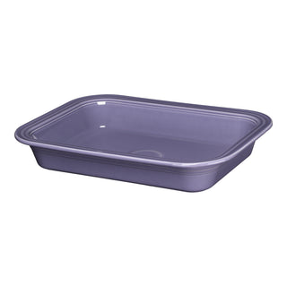 The Fiesta Lavender Rectangular 9x13 Inch Baker, 3 Quart, is a purple ceramic dish with rounded corners and a glossy finish. Oven safe and made in the USA, it's shown on a white background.