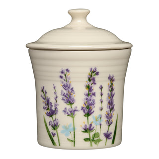 Cream-colored Lavender Bloom 13 OZ Mini Canister 5 5/8 Inch with a lid, decorated with a lavender floral pattern.