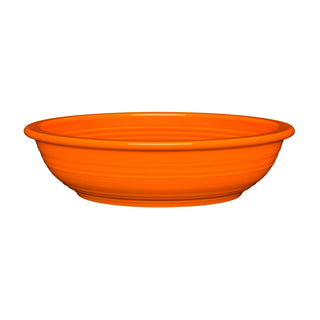 The Fiesta Retired Large Pasta Bowl is a bright orange, round ceramic bowl with a smooth, glossy finish and slightly flared rim, shown on a white background.