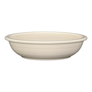 The Fiesta Classic Rim 8 3/8 Inch Pasta Bowl in Linen, a shallow, round off-white bowl with a slightly flared rim (34 oz), is made in the USA and shown against a white background.