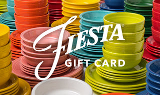 A variety of colorful Fiesta dinnerware, including plates and bowls, are stacked high. The words “Fiesta Gift Card” are displayed prominently in white text across the image.