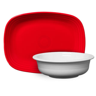 The Fiesta Factory Direct Rectangle Platter in bright red sits behind the Large Serving Bowl with a gray base, both displayed on a plain white background.