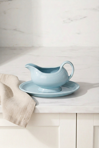 A light blue Fiesta Factory Direct Sauceboat and Small Oval Platter.