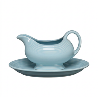 Light blue Fiesta Factory Direct Sauceboat and Small Oval Platter resting on a matching oval platter.