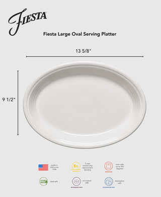 A Lavender Fiesta 13 5/8 Inch Large Oval Serving Platter is centered on a gray background. Made in the USA and lead-safe, this china platter highlights product details and brand markings.
