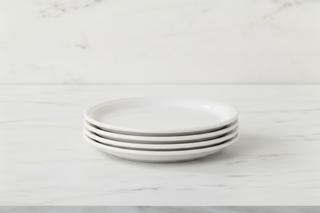Stack of 2 white plates on marble
