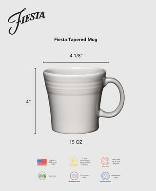 The Fiesta Lavender 15 OZ Tapered Mug is a white ceramic mug with a handle, measuring 4" tall and 4⅛" wide. Lead safe, microwave and dishwasher safe, this mug is proudly made in the USA.