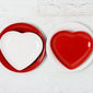 Scarlet and White heart plates stacked on regular plates of the opposite color